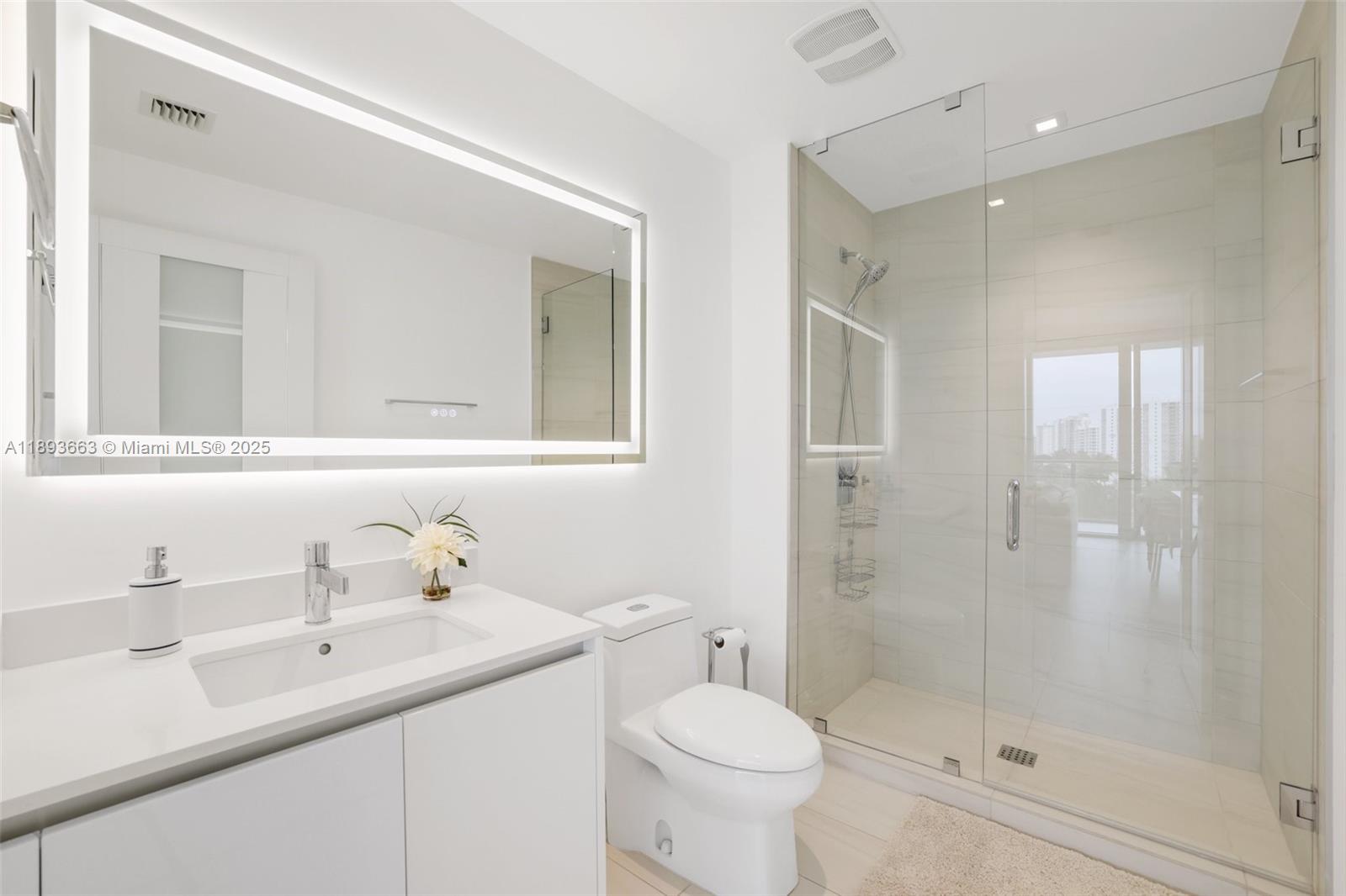 2200 North Ocean Boulevard, Unit N504 Fort Lauderdale, FL 33305 - Photo 24 of 43 a bathroom with a sink a toilet and shower