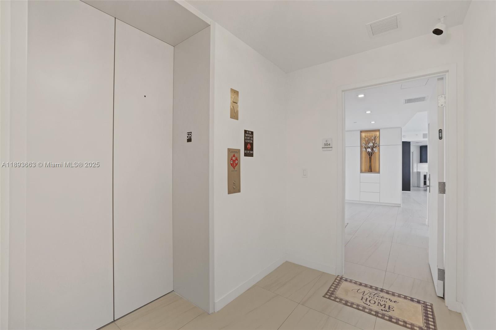 2200 North Ocean Boulevard, Unit N504 Fort Lauderdale, FL 33305 - Photo 26 of 43 a view of a hallway with wooden floor