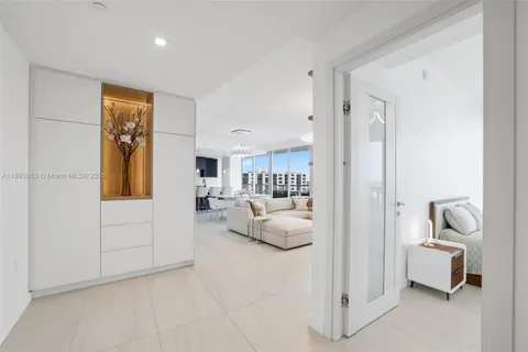 a view of living room filled with furniture and a rug
