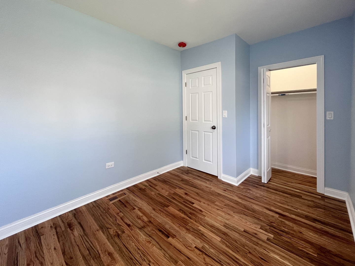 1111 North Keystone Avenue Chicago, IL 60651 - Photo 13 of 34 a view of an empty room and wooden floor