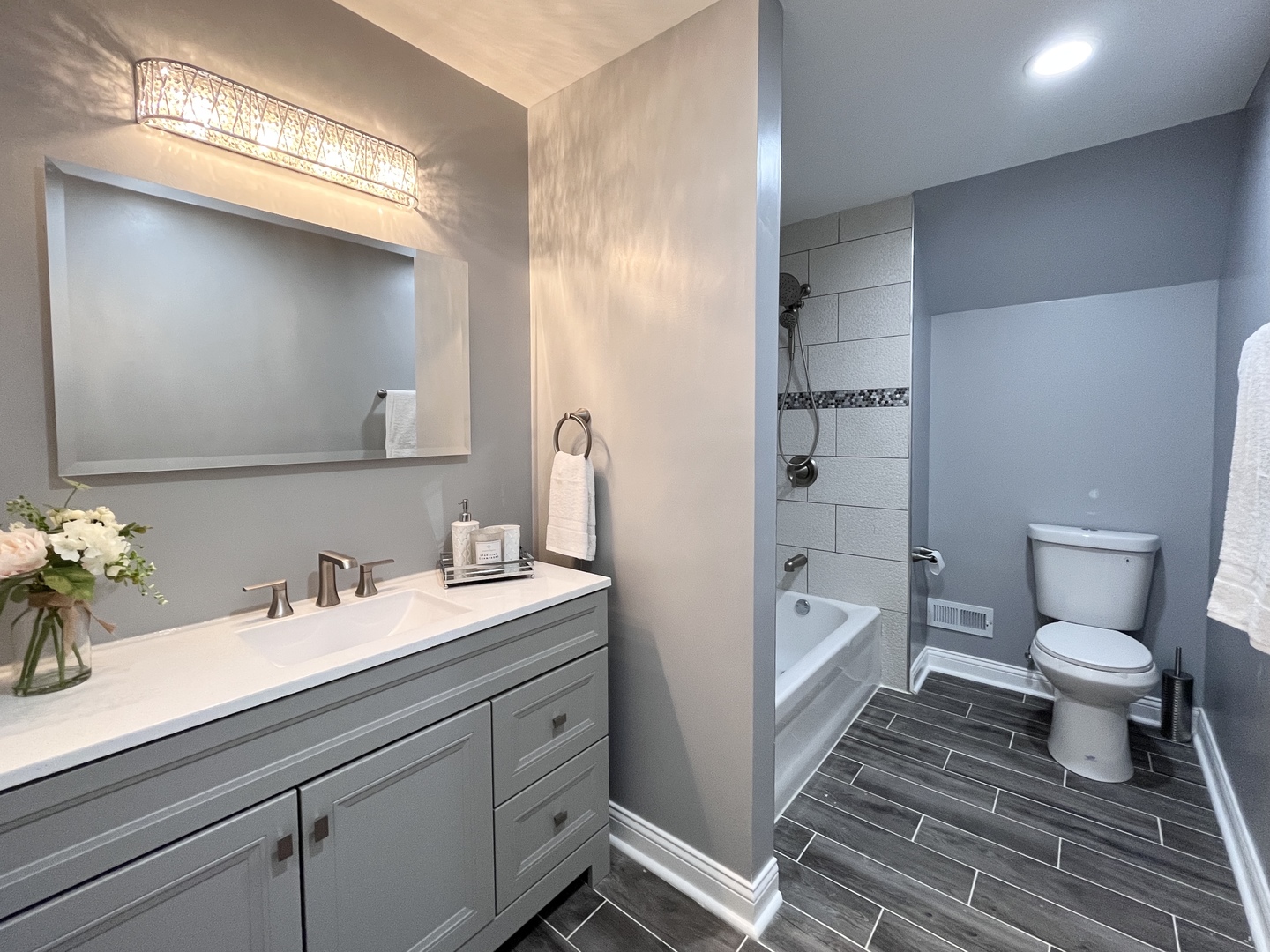 1111 North Keystone Avenue Chicago, IL 60651 - Photo 20 of 34 a bathroom with a sink a toilet and shower