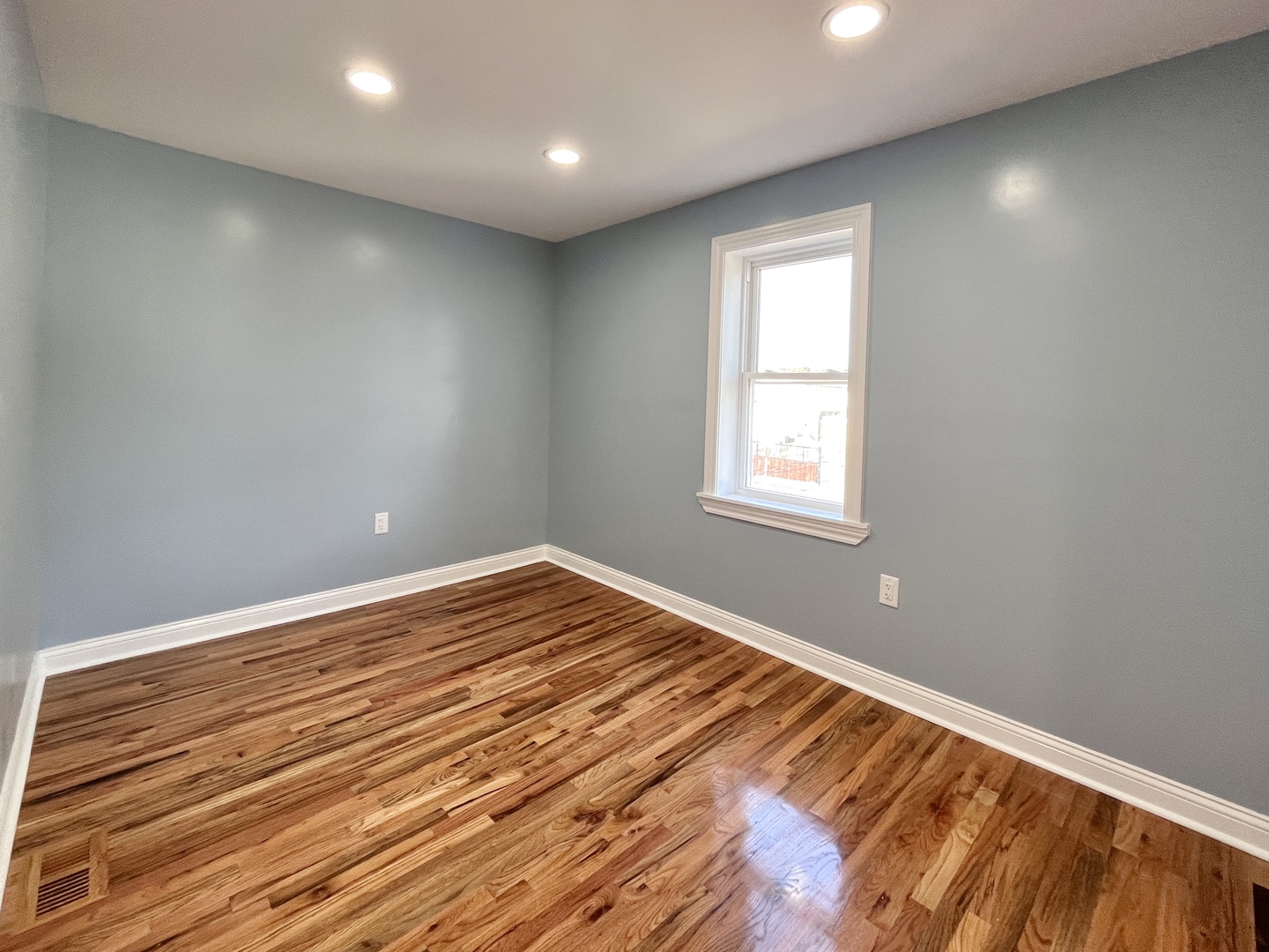 1111 North Keystone Avenue Chicago, IL 60651 - Photo 23 of 34 a view of empty room with wooden floor and fan