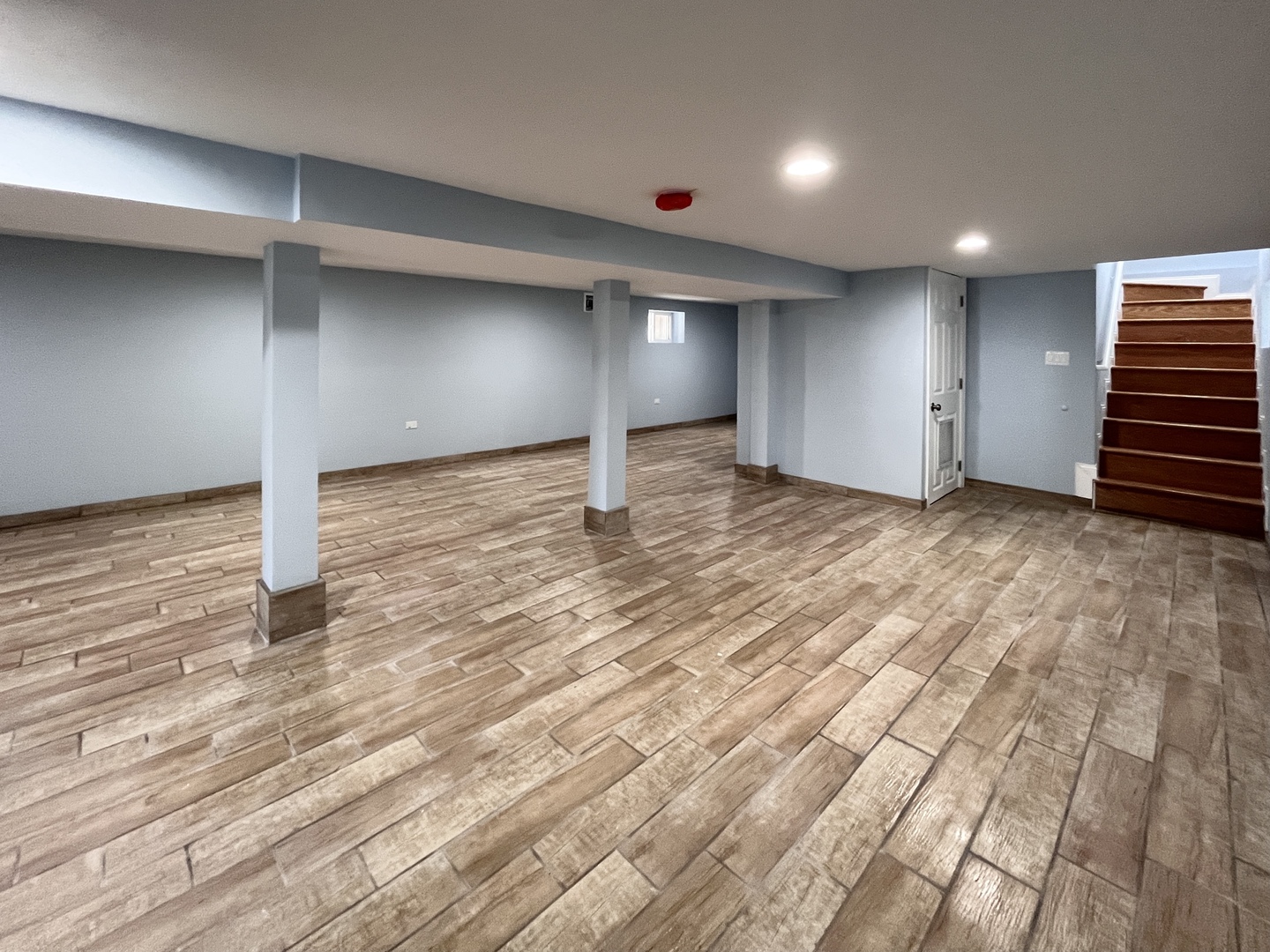 1111 North Keystone Avenue Chicago, IL 60651 - Photo 25 of 34 a view of an empty room with wooden floor and a window