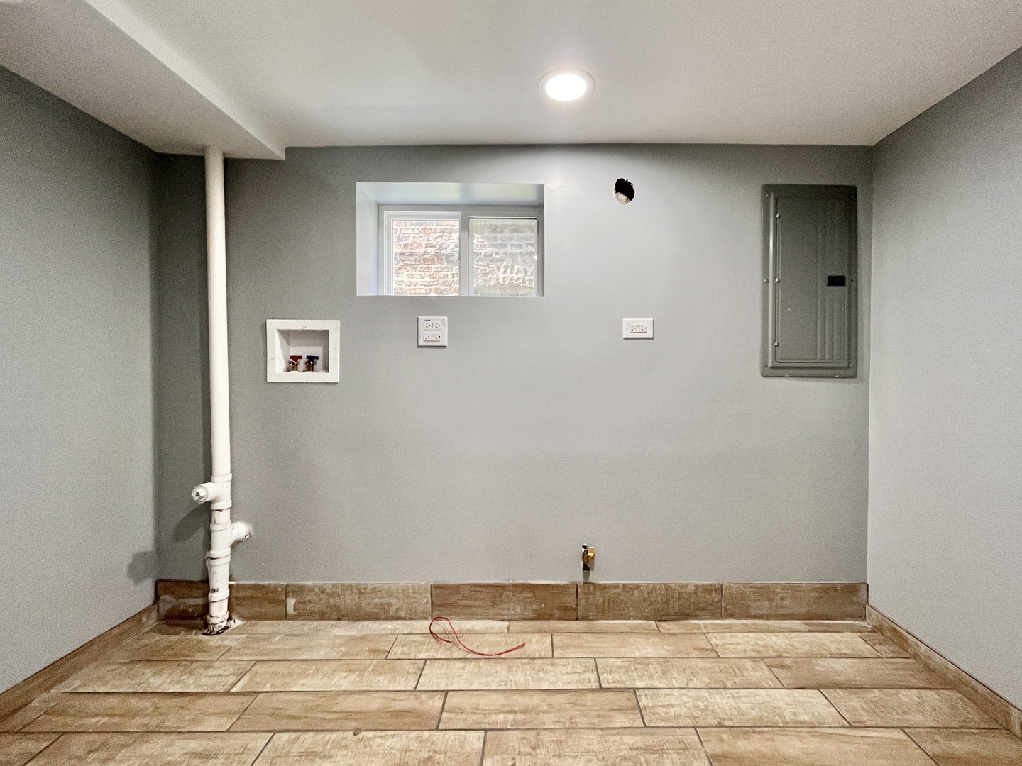 1111 North Keystone Avenue Chicago, IL 60651 - Photo 29 of 34 a view of a livingroom with wooden floor and a window