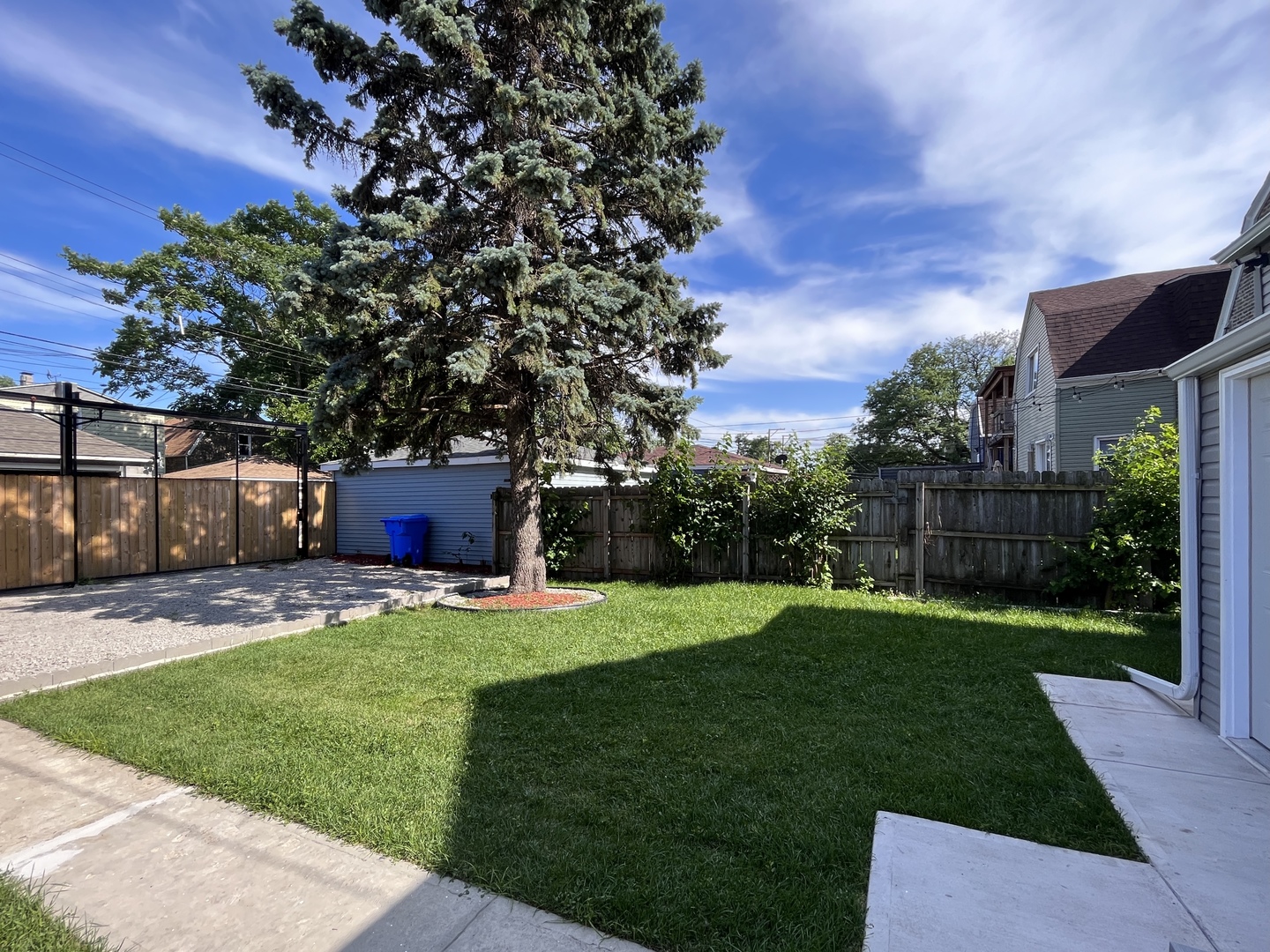 1111 North Keystone Avenue Chicago, IL 60651 - Photo 32 of 34 a backyard of a house with table and chairs