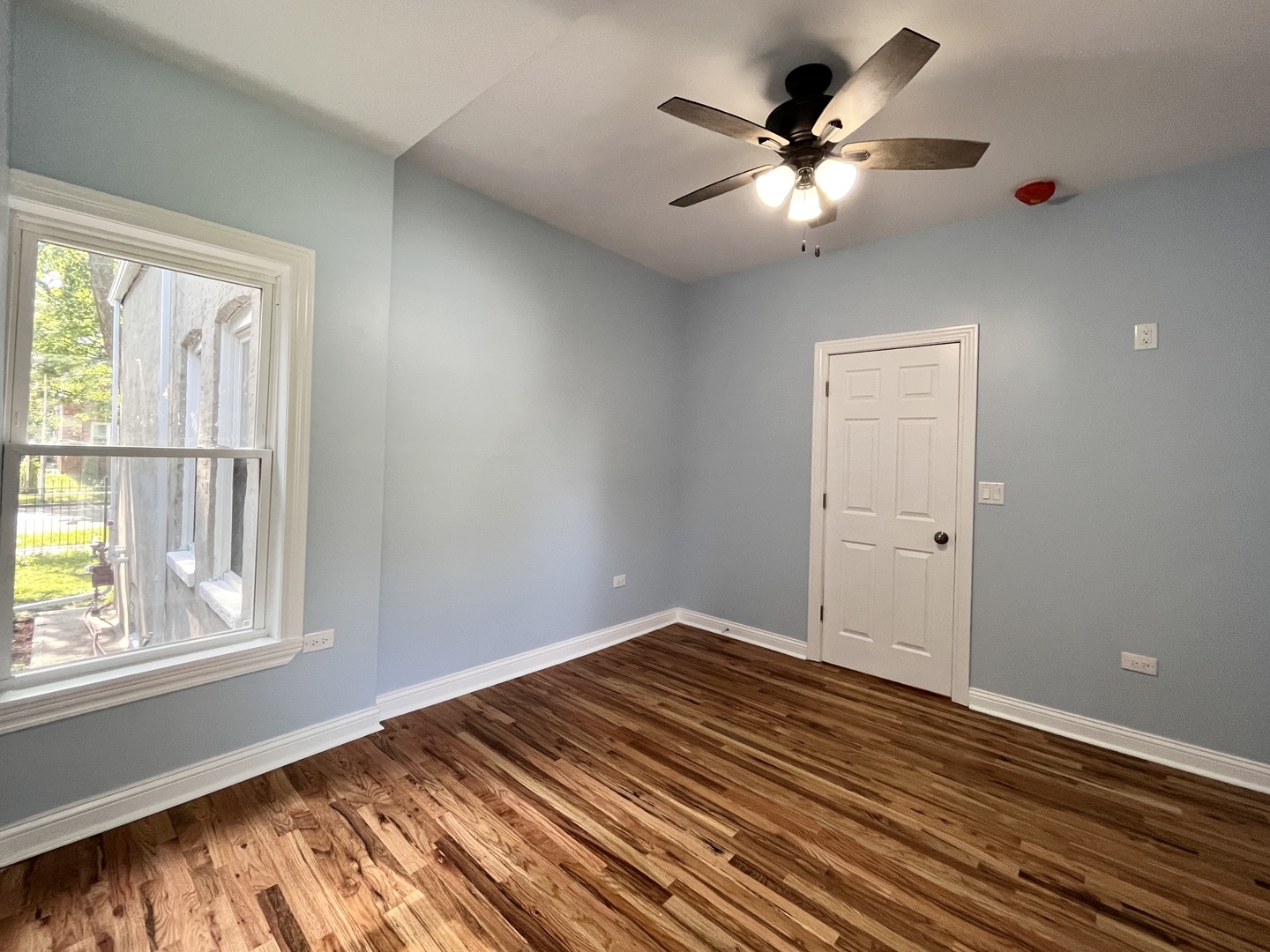 1111 North Keystone Avenue Chicago, IL 60651 - Photo 10 of 34 a view of an empty room with a window