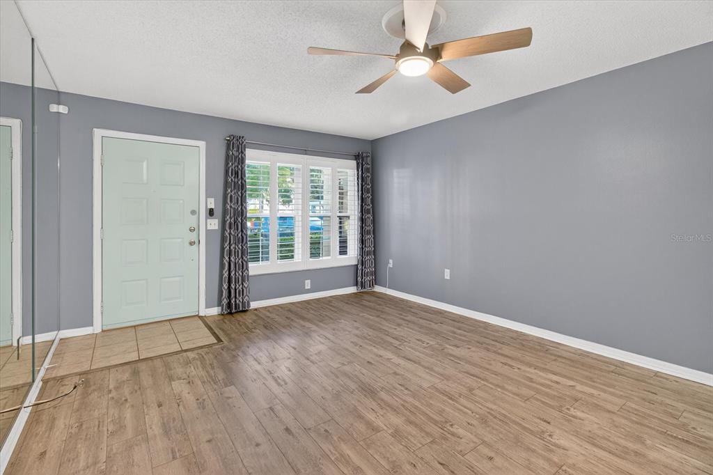 7802 Hardwick Drive, Unit 1116 New Port Richey, FL 34653 - Photo 18 of 73 wooden floor in an empty room with a window