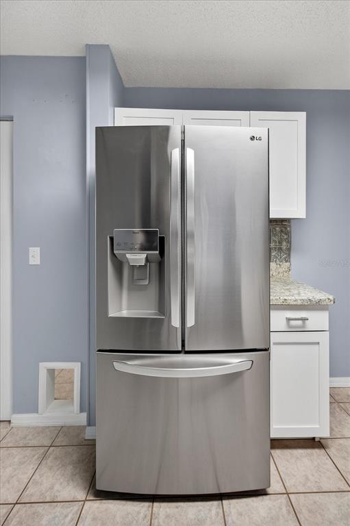 7802 Hardwick Drive, Unit 1116 New Port Richey, FL 34653 - Photo 23 of 73 a view of a refrigerator in kitchen and stainless steel appliances