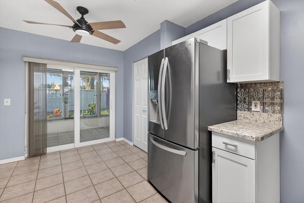 7802 Hardwick Drive, Unit 1116 New Port Richey, FL 34653 - Photo 24 of 73 a kitchen with stainless steel appliances granite countertop a refrigerator a sink and a stove