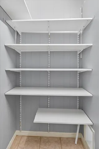 a bathroom with a granite countertop sink a mirror and a bathtub