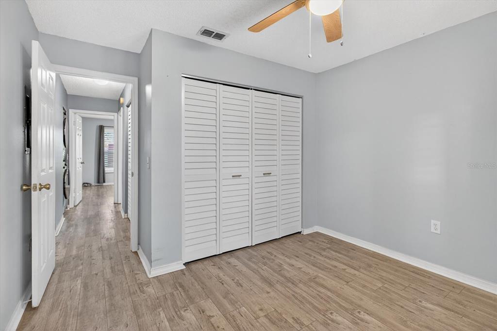7802 Hardwick Drive, Unit 1116 New Port Richey, FL 34653 - Photo 29 of 73 wooden floor in an empty room with a window