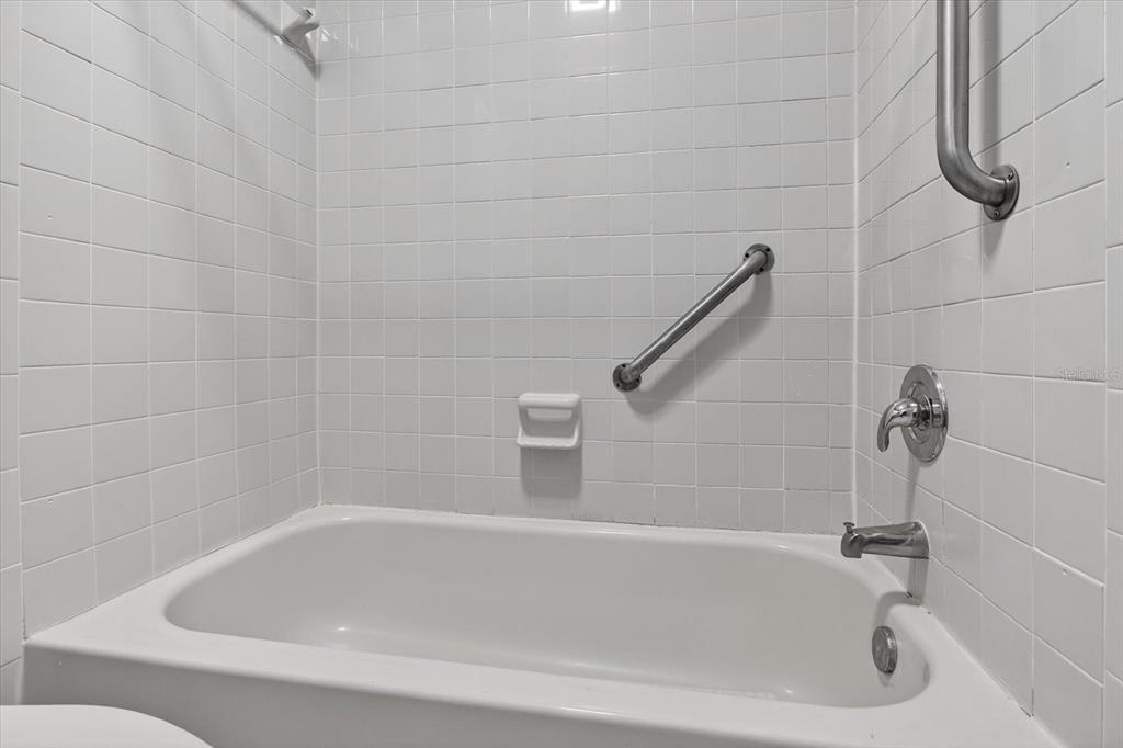 7802 Hardwick Drive, Unit 1116 New Port Richey, FL 34653 - Photo 36 of 73 a white bath tub and a shower
