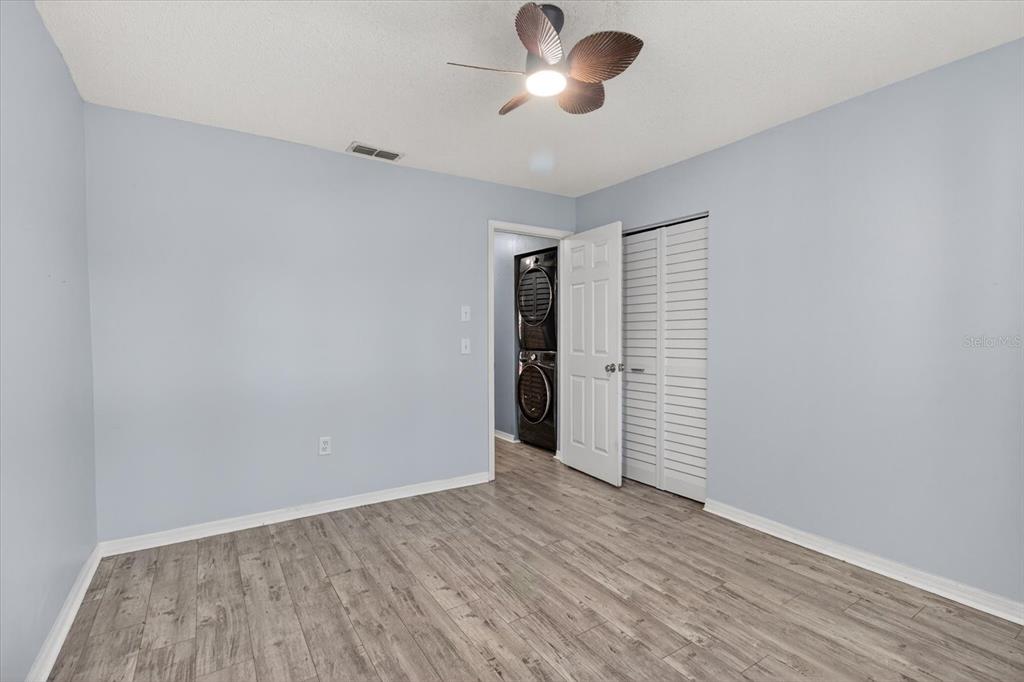 7802 Hardwick Drive, Unit 1116 New Port Richey, FL 34653 - Photo 39 of 73 wooden floor in an empty room with a window