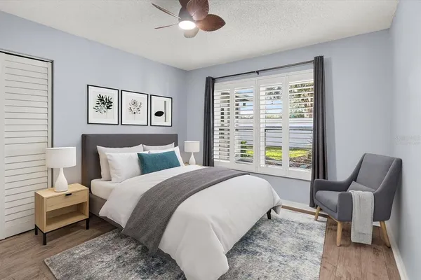 a spacious bedroom with a bed and a couch