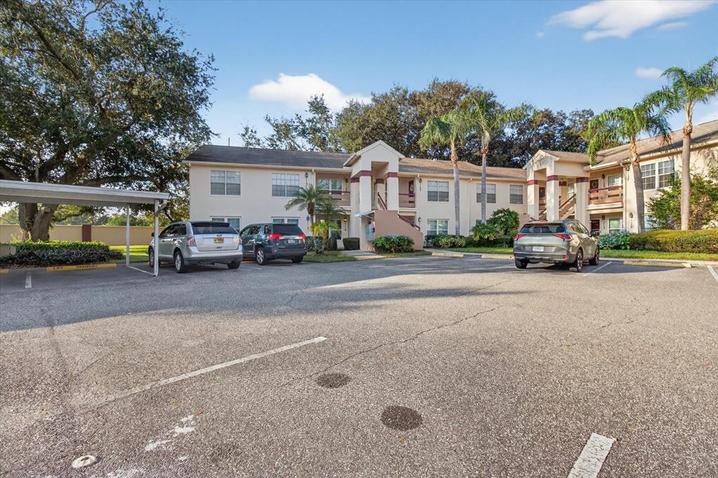 7802 Hardwick Drive, Unit 1116 New Port Richey, FL 34653 - Photo 55 of 73 a car parked on the side of a street