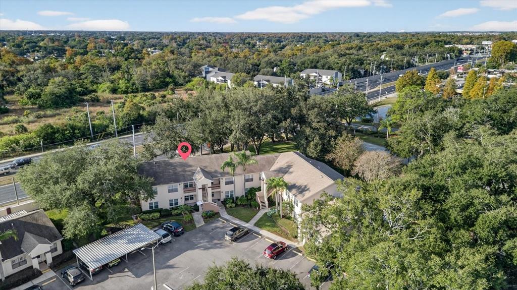 7802 Hardwick Drive, Unit 1116 New Port Richey, FL 34653 - Photo 62 of 73 an aerial view of a house with a yard