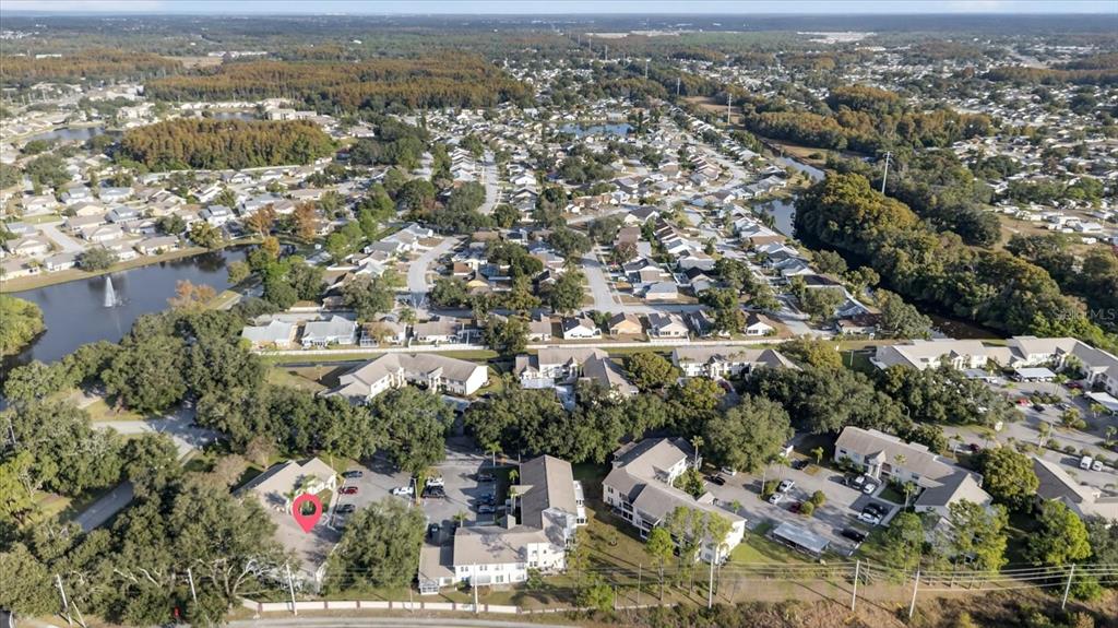 7802 Hardwick Drive, Unit 1116 New Port Richey, FL 34653 - Photo 70 of 73 an aerial view of a city with lots of residential buildings