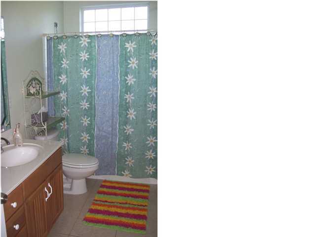 2572 Richardson Road Crestview, FL 32539 - Photo 17 of 24 a bathroom with a sink a toilet and shower