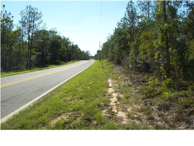 2572 Richardson Road Crestview, FL 32539 - Photo 23 of 24 a view of a field with trees in the background