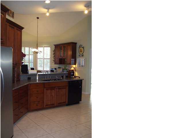 2572 Richardson Road Crestview, FL 32539 - Photo 7 of 24 a kitchen with stainless steel appliances granite countertop a refrigerator and a sink