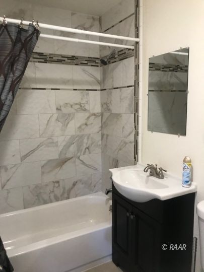 209 West French Avenue Ridgecrest, CA 93555 - Photo 6 of 22 a bathroom with a sink and a bathtub