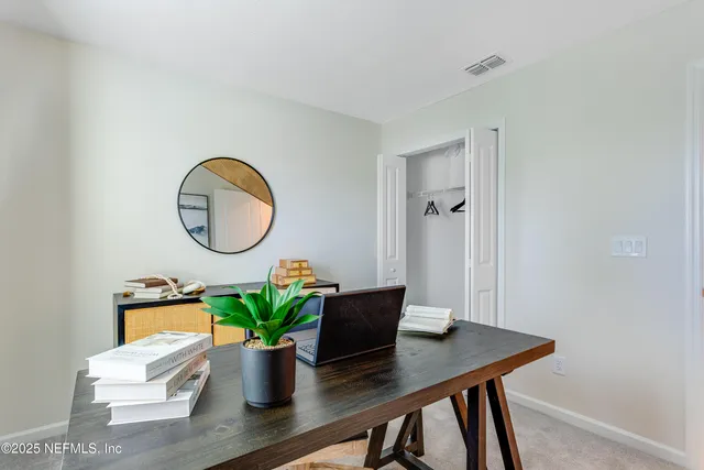 a workspace with furniture and wooden floor