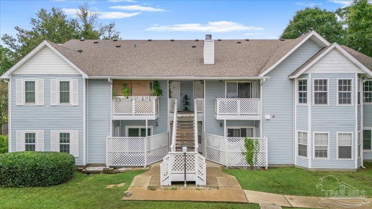 601 East Burgess Road, Unit C3 Pensacola, FL 32504 - Photo 3 of 35 a front view of a house with a yard