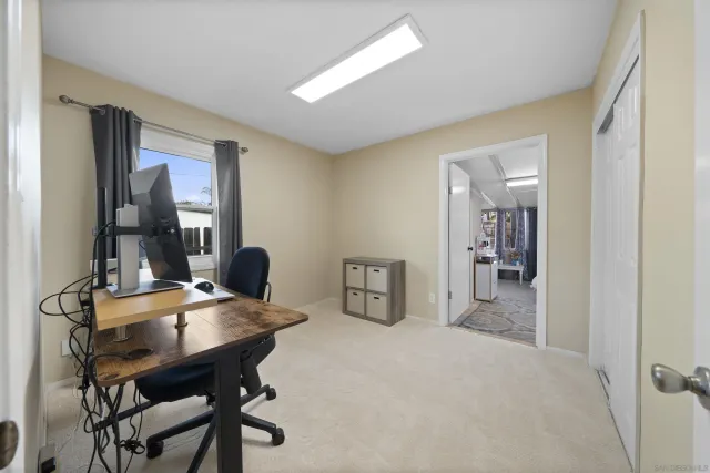 a view of a workspace with furniture