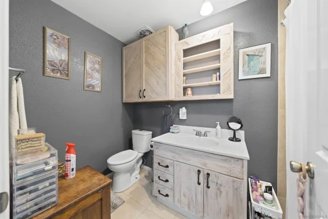 a roof deck with table and chairs