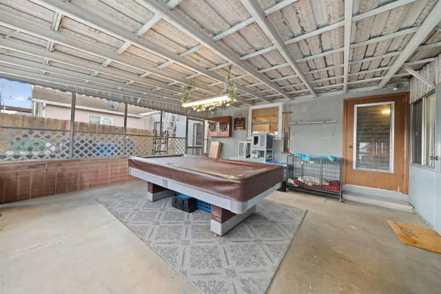 a view of a house with a backyard porch and sitting area