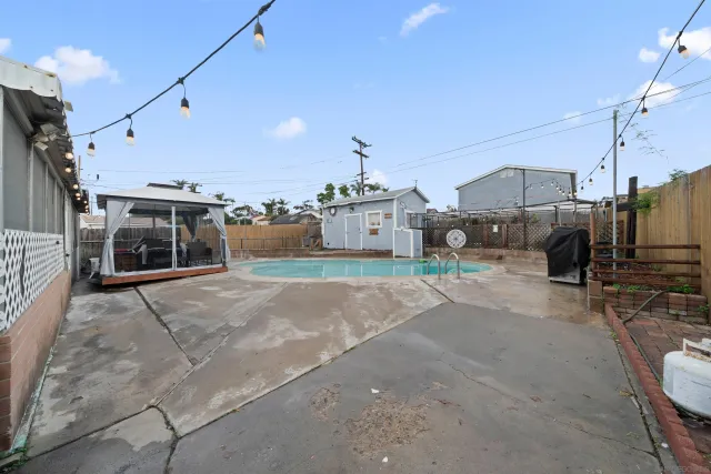 a view of a swimming pool with a house