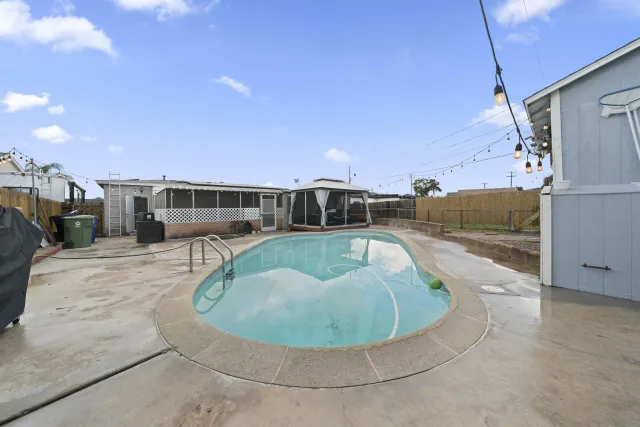 a view of swimming pool with a patio