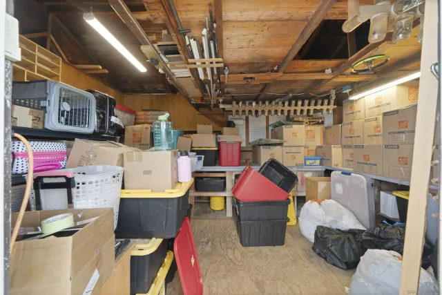 a kitchen with stainless steel appliances granite countertop a refrigerator and a stove