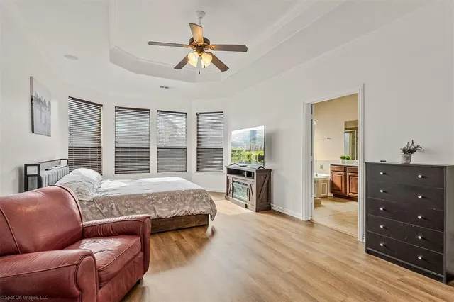 a spacious bathroom with a shower sink mirror and a bathtub