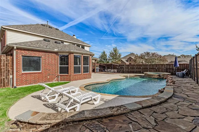 a front view of a house with swimming pool