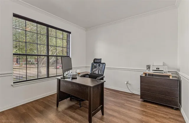 a dining room with furniture and wooden floor