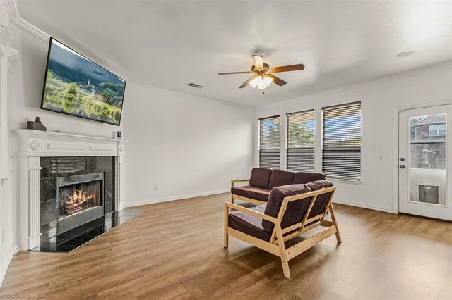 a kitchen with granite countertop a stove top oven a sink a dining table and chairs