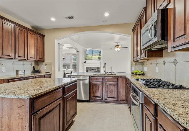 a bedroom with furniture and wooden floor