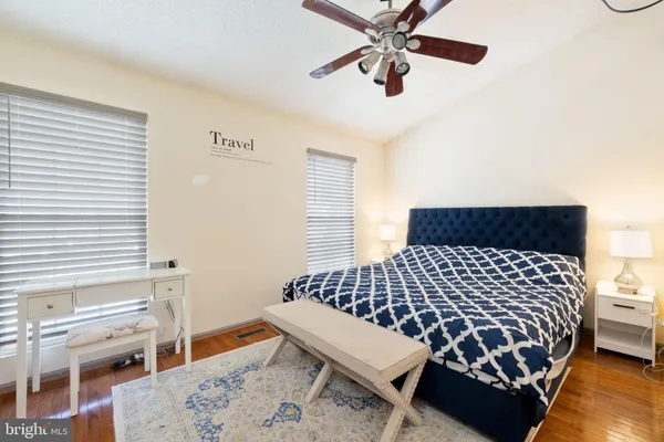 a bedroom with a bed and dresser