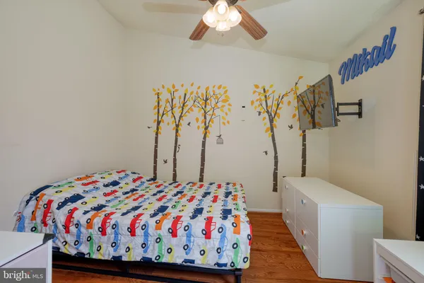 a bedroom with a bed and a table