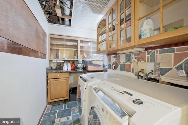 a utility room with dryer and washer
