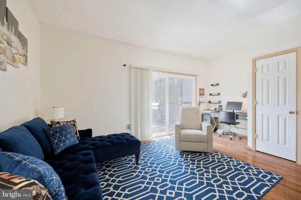 a living room with furniture and a rug