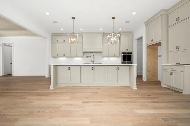 a bathroom with a double vanity sink mirror and