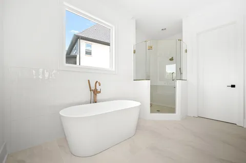 an empty room with a empty space and windows