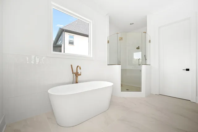 an empty room with a empty space and windows