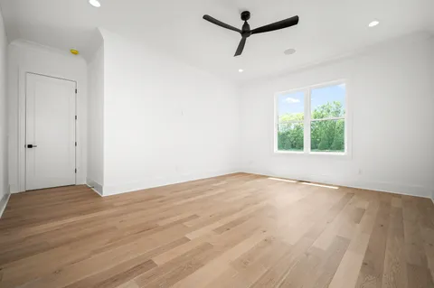 an aerial view of a swimming pool with a garden and plants