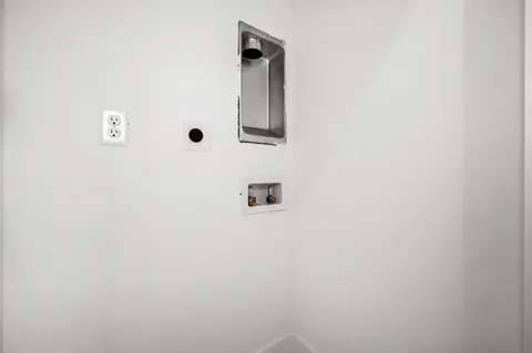 a view of a park with iron fence