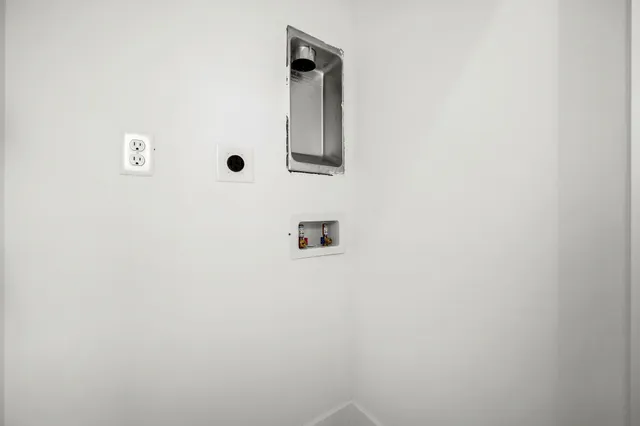 a view of a park with iron fence