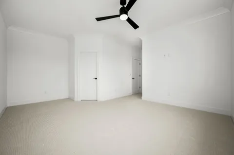 an aerial view of a house with a yard and lake view