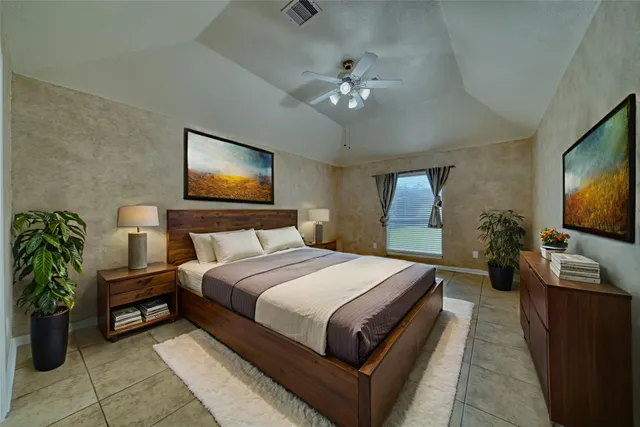 a spacious bathroom with a granite countertop sink a large mirror and a bathtub with shower